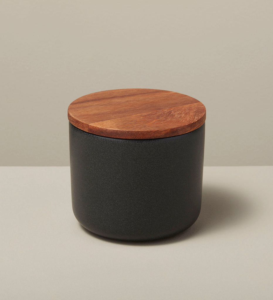 https://www.allredcollaborative.com/cdn/shop/products/Allred_Co-Be_Home-Be-Home_Stoneware-Container-with-Acacia-Lid-Black-Medium_52-09BK_1600x.jpg?v=1659636732