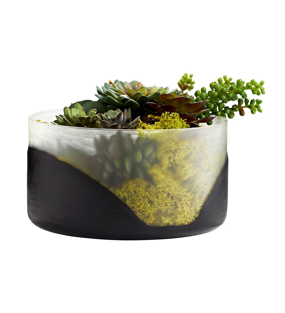 Flat Ominous Frost Vase with succulents and greenery placed inside.