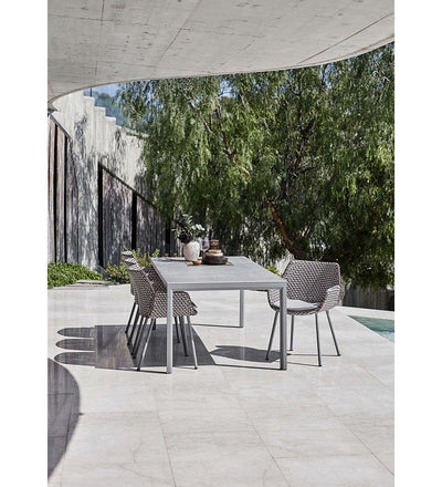 lifestyle, Cane-line Drop Outdoor Dining Table in Light Grey Aluminum Base and Concrete Grey Ceramic Top 50406AI P091CB