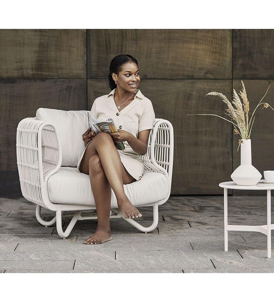lifestyle, Cane-line Nest Outdoor Lounge Chair in White All Weather Rattan Weave and White Cushions
